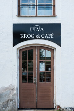 Ulva, Uppland - Sweden - Wooden entrance door and facade of the Ulva Kvarn Krog and Cafe