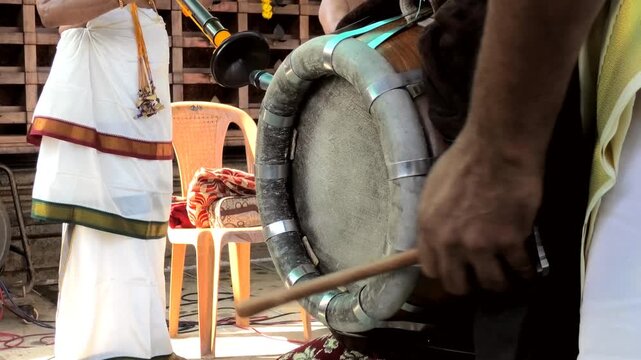 Thavil and Nagaswaram (Thakil and Nadaswaram) performed together in the procession of a temple festival celebration in Kerala, India	