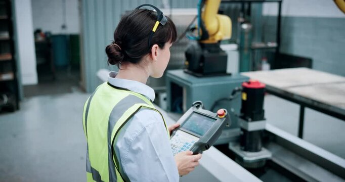 Engineering, controller and manufacturing with woman in workshop for industrial, automation and inspection. Robotics, technician and machinery with person in factory for safety and production line