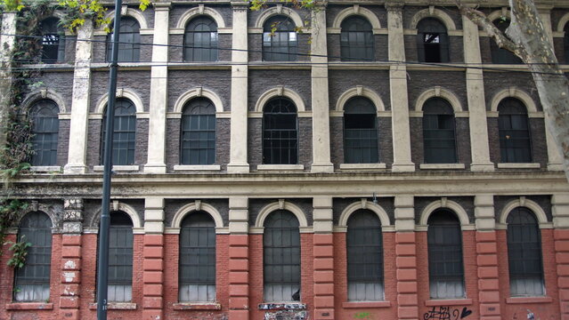 Old factory building with arched windows in Buenos Aires, Argentina