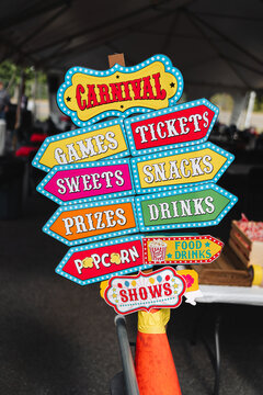 Colorful carnival direction signs at event