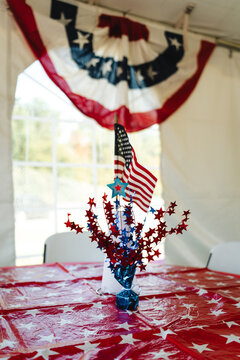 Patriotic table centerpiece with American flag and star decorations
