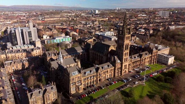 Drone view of Kelvingrove Park and Gilmorehill on a sunny golden hour winter morning in Glasgow Scotland