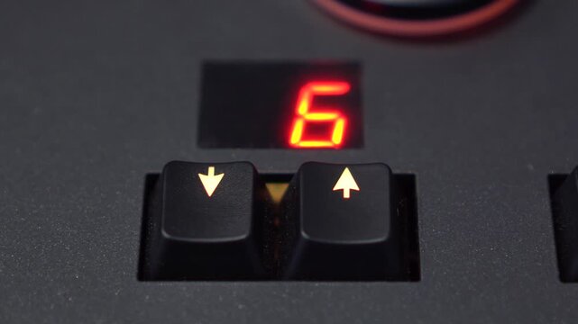 Close-Up Finger Changing Preset with Arrow Buttons on Lighting Mixer, 4K