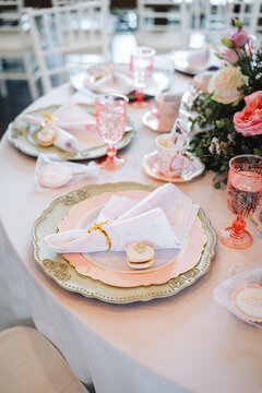 Elegant pastel pink table setting for wedding or high tea party