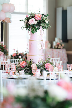 Elegant pink hat box floral centerpiece on wedding reception table