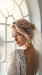Fototapeta premium Couture Bride by Arched Window in Lace Wedding Dress and Veil