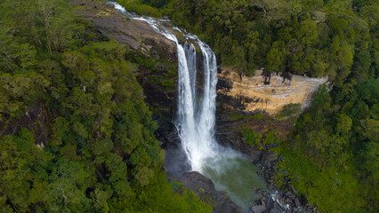 Fototapeta premium Waterfall in the mountains. Laxapana Falls. Areal view of Laxapana Falls.