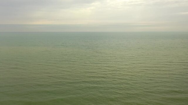 Aerial view of residential houses on a coastal bluff overlooking Lake Michigan shoreline in Wisconsin. Scenic early spring landscape with beach and clif