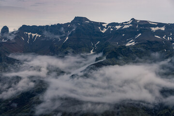 Fototapeta premium view from the mountain Kristínartindar to the peaks in the clouds