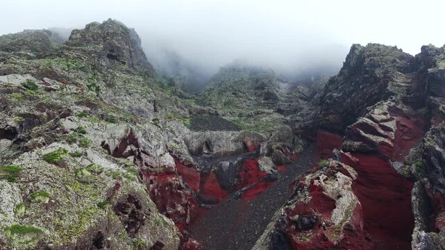Aerial Panoramic View Dramatic Multi Colored Volcanic Cliffs Red Basalt Clouds Mist El Hierro Canary Islands Spain