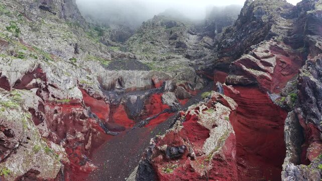 Aerial Panoramic View Dramatic Multi Colored Volcanic Cliffs Red Basalt Clouds Mist El Hierro Canary Islands Spain
