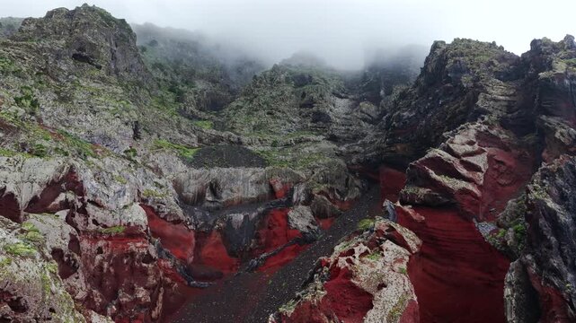 Aerial Panoramic View Dramatic Multi Colored Volcanic Cliffs Red Basalt Clouds Mist El Hierro Canary Islands Spain