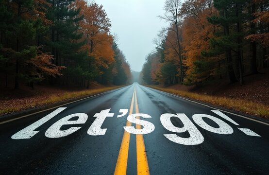Wet asphalt road with text let go painted on surface. Trees with orange leaves line path. Drive forward towards horizon, start new adventure, journey begins now.