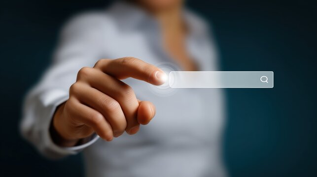 Main pointant vers une barre de recherche virtuelle transparente