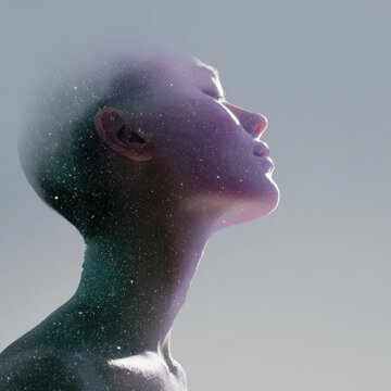 Female asian young upturned profile dissolving particles neck elongation cosmic glow contemplative pose