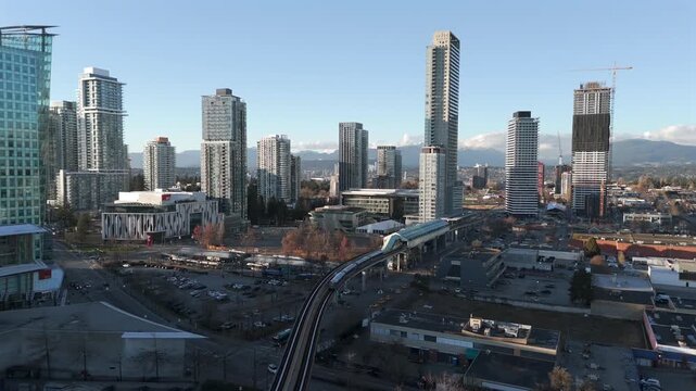 King George Subway Station With Apartment Tower Complex In Surrey City Centre, British Columbia, Canada. Aerial Rotate Shot