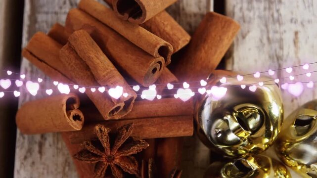 Animation of heart string lights,cinnamon sticks and christmas decorations
