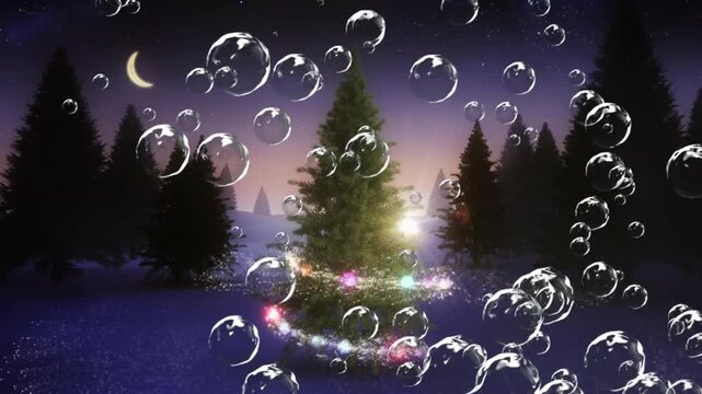 Animation of bubbles floating and shooting star over christmas tree on winter landscape in night sky