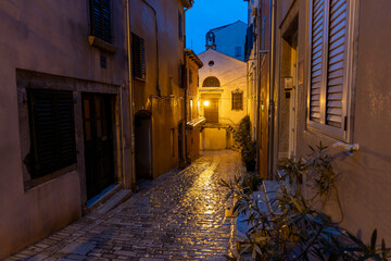 Cobblestone street in old town at night