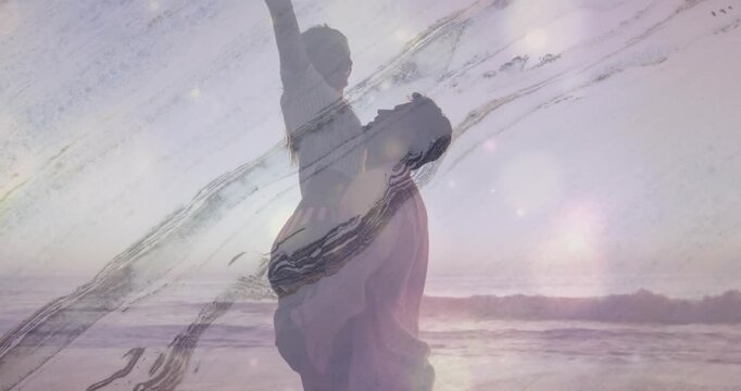 Couple lifting woman on sandy beach at sunset, overlaying travel app icons and pastel data chart