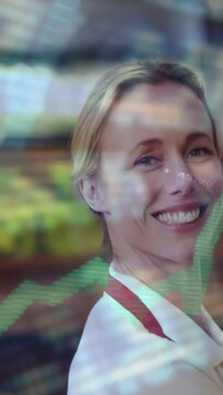 Vertical video: Grocery clerk greeting customer, turning and smiling as graphs overlaying produce