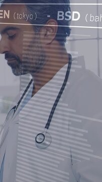 Vertical video: Male clinician tapping tablet, causing currency overlay YEN BSD GBP, checking rates