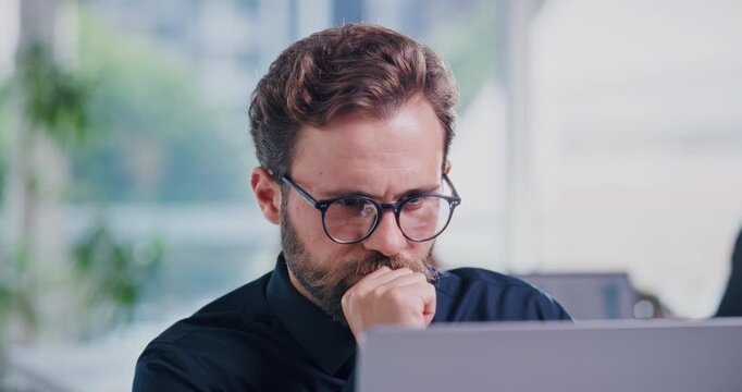 Review, glasses or man in firm with laptop, budget editing or insight for funding pitch. Tech, meeting or finance consultant in office with specs, expense evaluation or proposal ideas for investment.