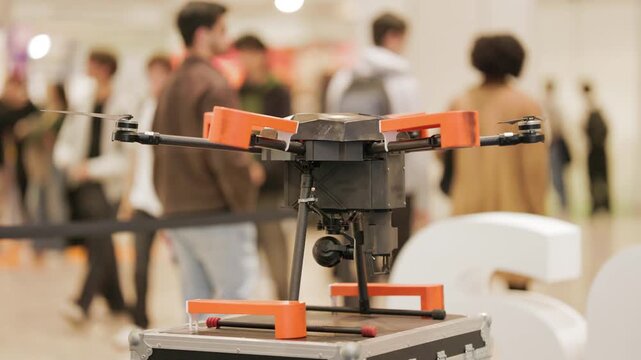 Professional quadcopter drone displayed at technology exhibition