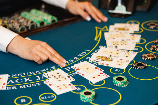 Blackjack Table with Dealer and Cards Close-Up