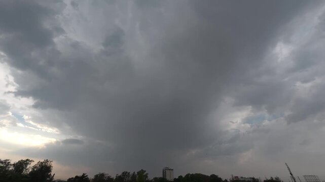 Dramatic Storm Clouds Time Lapse with Sun Breaking Through at Golden Hour