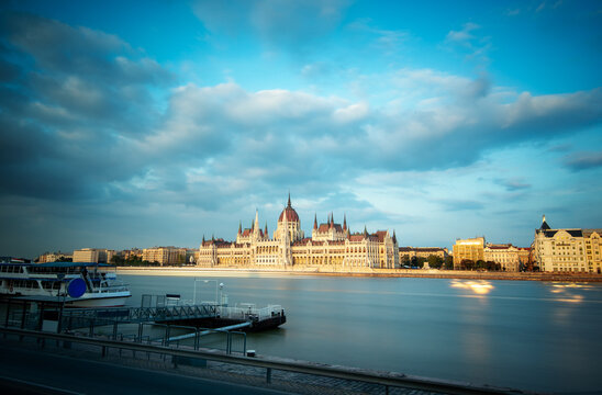 Panoramic view of the amazing Hungarian Parliament building in Budapest on the banks of the Danube river before sunset