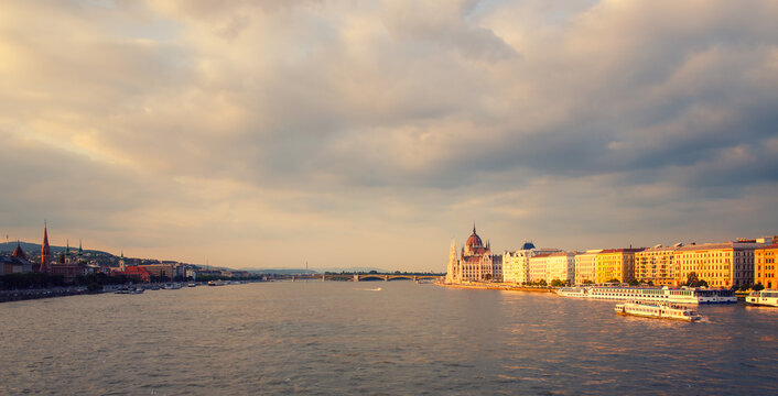 Panoramic view of the amazing Hungarian Parliament building in Budapest on the banks of the Danube river before sunset