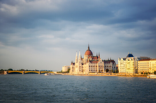 Panoramic view of the amazing Hungarian Parliament building in Budapest on the banks of the Danube river before sunset