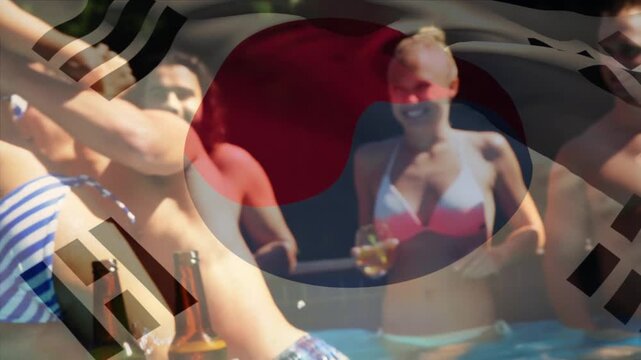 Animation of flag of south korea over happy caucasian friends having fun at swimming pool