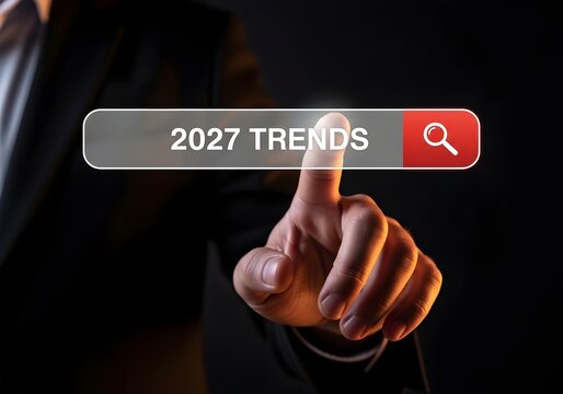 Person searching for future trends online with finger hovering over search button on dark background.