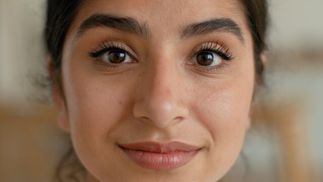 Portrait close up happy Indian woman at home smiling attractive beautiful healthy young female looking at camera lady relaxed glamour optimistic confident face eyes skin model pretty indoors apartment
