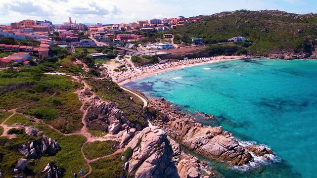 Italy Sardinia Aerial 4K Drone Video Slow Flying Over Granite Rocks Towards Santa Teresa Gallura Pink Town and Turquoise Beach Scenic Mediterranean Coastline Summer Travel