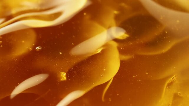 abstract flowing honey texture background, macro detail, golden lighting, smooth motion