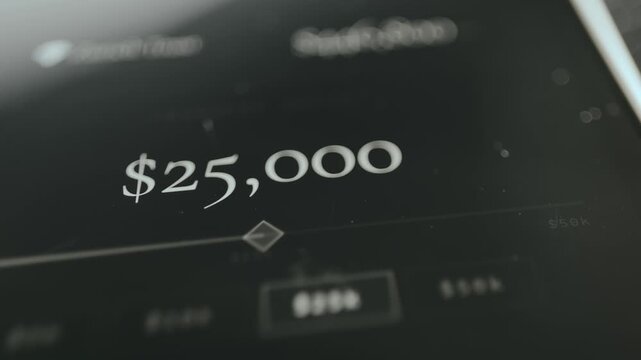 A person selects a USD amount from the options in the app interface, close-up view