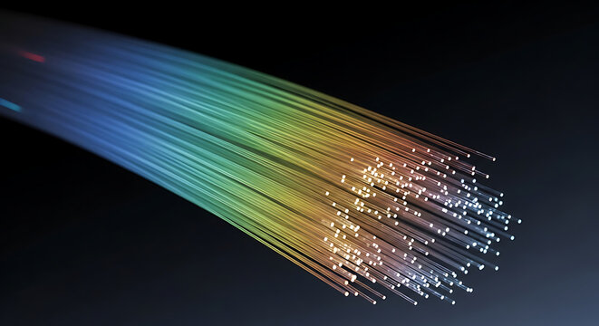 A spectrum of rainbow light radiates from bundled fiber optic cables.