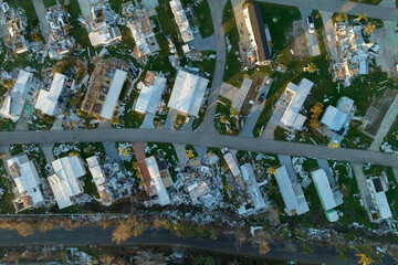 Destroyed by hurricane Ian suburban houses in Florida mobile home residential area. Consequences of natural disaster