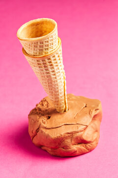 Waffle cone or ice cream cone, for ice cream, dessert, pink background, vertical, Spain.