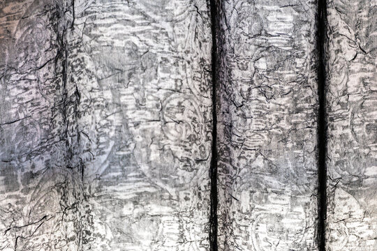 Imagem de fundo formada por uma textura t&ecirc;xtil 
