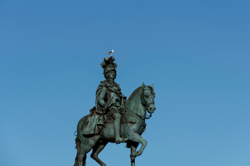 Naklejka premium Equestrian Statue in Praça do Comércio, in the city of Lisbon, Portugal