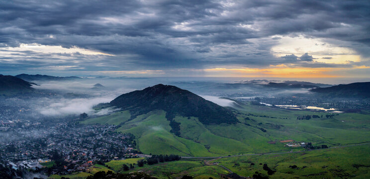 Panorama springtime with hill, mountain and city at sunrise