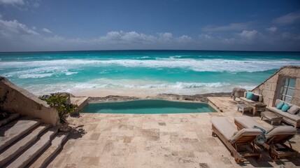 Fototapeta premium Oceanfront luxury residence with pool and lounge chairs on sunny beach