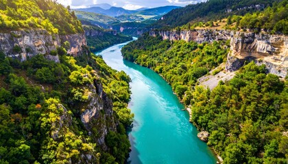 Obraz premium Aerial View of River Flowing Through Canyon.