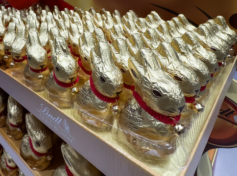 Golden chocolate Easter bunnies in foil wrapping on store shelves, seasonal confectionery retail: 27.03.2026 -Ljubljana, Slovenia