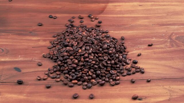 Video of Decaf coffee beans pouring macro vertical slow motion.